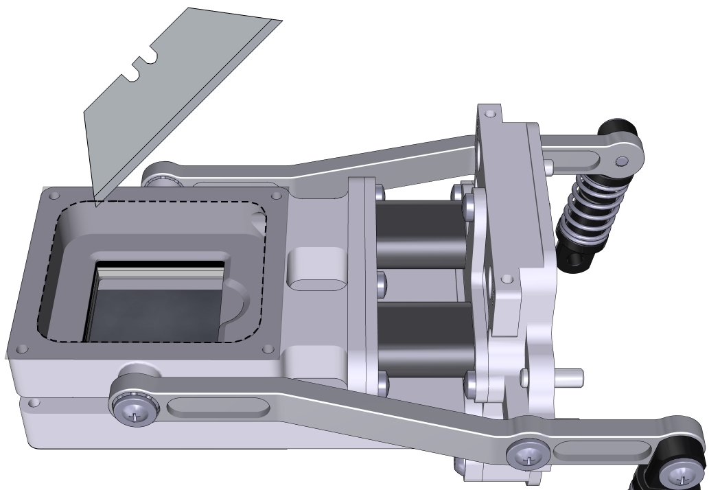 Cut the adhesive tape with a razor, leaving tape on the outer perimiter of the chamber.